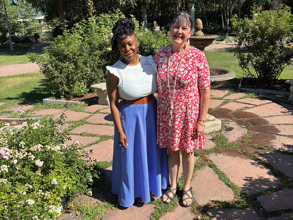 Two people standing together in the garden